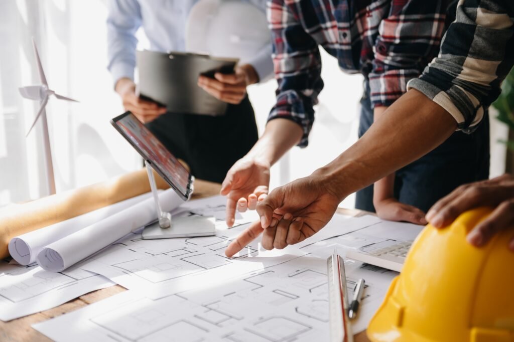 Engineer and contractor join hands after signing contract,They are having a modern building project